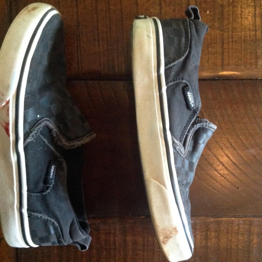 Black checkered beat up vans